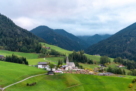 Charming Village at Lago di Braies, Italy Amidst Lush Green Hillsの写真素材