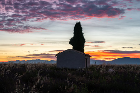 Stunning Sunset Over a Rustic House in Provence, Franceの写真素材