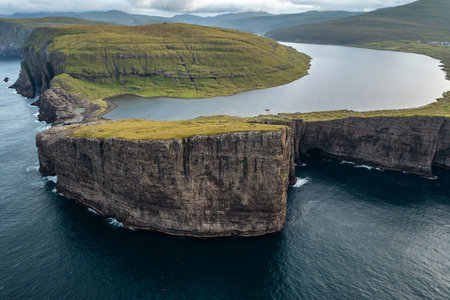 Stunning Aerial View of Faroe Islands Cliffs and Waterscapeの写真素材