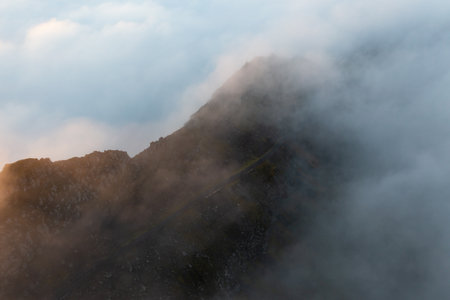 Misty Aerial View of Faroe Islands Mountains in Late Summerの写真素材