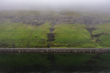 Aerial View of Lush Green Hills in Faroe Islands During Late Summerの写真素材
