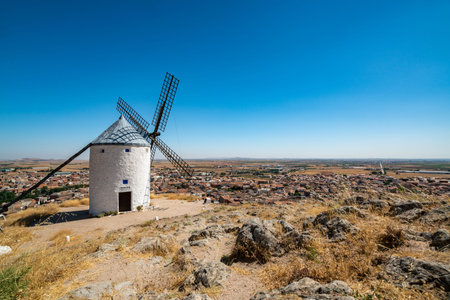 Iconic Consuegra Windmills Under a Bright Summer Skyの写真素材