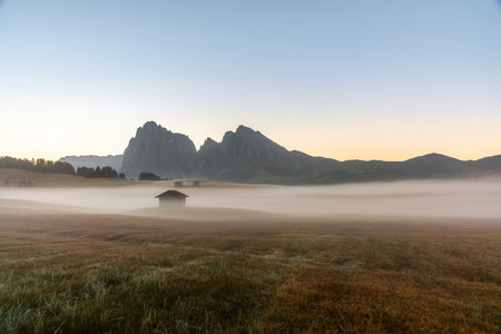 Beautiful Foggy Morning Landscape in the Italian Alpsの写真素材