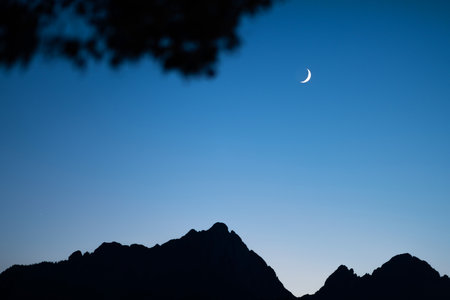 Stunning Twilight with Crescent Moonの写真素材