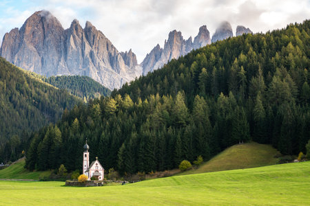 Stunning View of Santa Maddalena Church in the Alps, Italyの写真素材