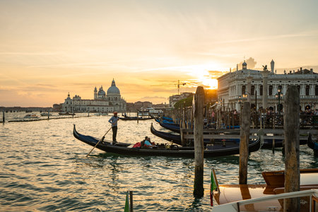 Stunning Sunset Over Gondolas in Venice, Italyの写真素材