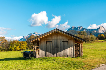 Charming Wooden Shed with Majestic Mountain Backdrop at Lago di Braies, Italyの写真素材