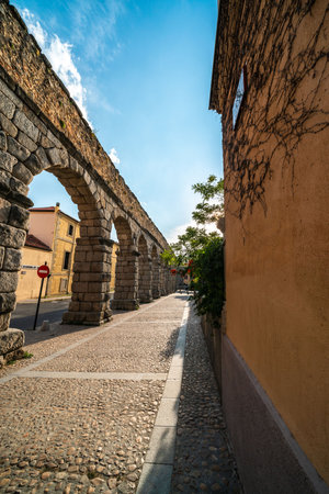 Historic Arcades of Segovia, Spain Beneath a Bright Skyの写真素材
