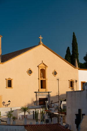 Charming Church Facade in Ibiza, Spain Against Clear Blue Skyの写真素材