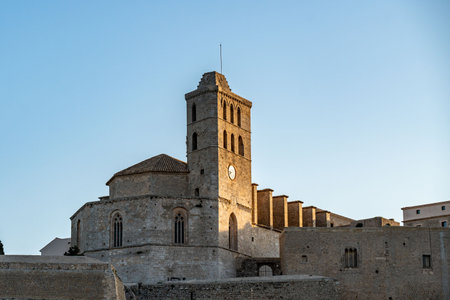 Historic Church and Tower in Ibiza at Sunsetの写真素材
