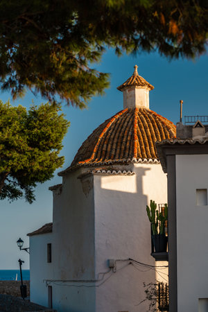 Charming White House with Traditional Tile Roof in Ibiza, Spainの写真素材