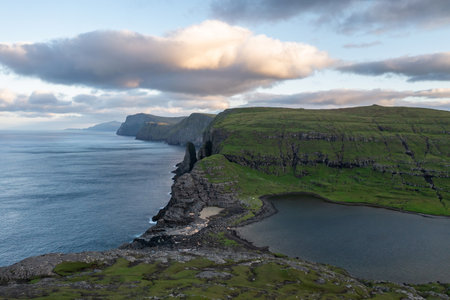 Stunning Aerial View of Faroe Islands Coastline at Sunsetの写真素材