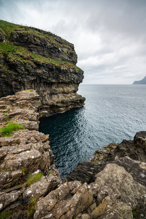 Stunning Coastal Cliffs of Faroe Islands in Late Summerの写真素材