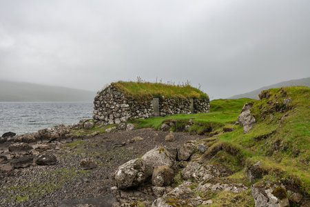 Tranquil Stone House by the Shore in Faroe Islandsの写真素材
