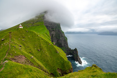 Aerial Panorama of Faroe Islands Lighthouse and Cliffs at Summers Endの写真素材