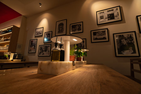Charming Bistro Interior with Olive Oil and Decorative Photos in Hamburg