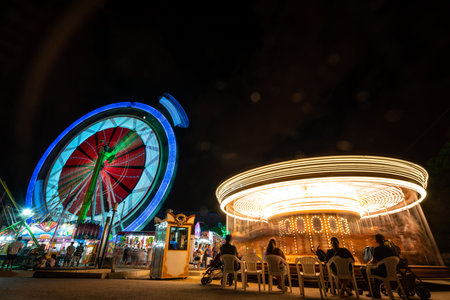 Vibrant Night Fair at Turia Park, Valencia, Spainの写真素材