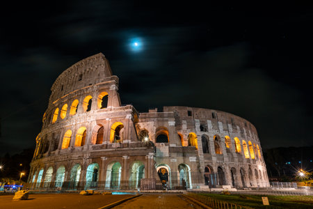 Illuminated Colosseum at Night in Rome, Italy