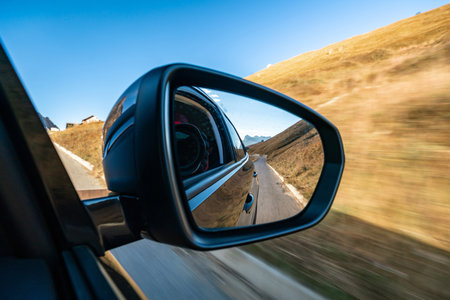 Scenic Drive Through the Italian Alps: Mirror Reflectionの写真素材