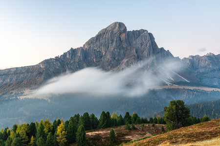 Majestic Alps Landscape with Misty Clouds in Italyの写真素材