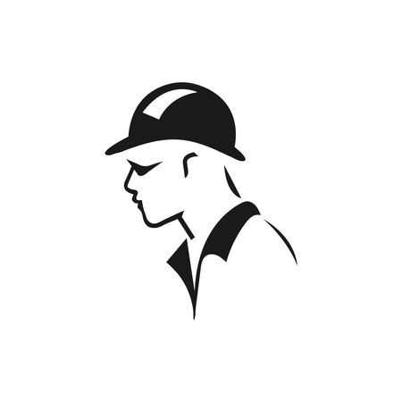 A builder, mechanic or tech man side profile. Work man in helmet or maintenance worker side profile silhouette. A builder, mechanic, plumber or electrician icon. Vector illustrationのイラスト素材