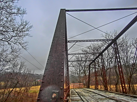 Old single lane bridge crossing a small stream.の写真素材