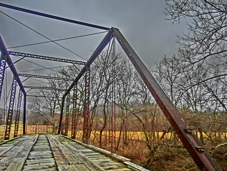 Old single lane bridge crossing a small stream.の写真素材