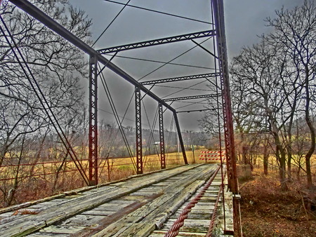 Old single lane bridge crossing a small stream.の写真素材