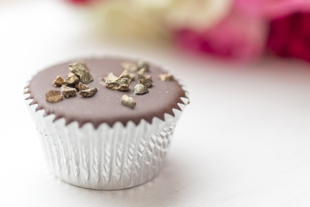 Chocolate mini cupcake with gold sprinkles