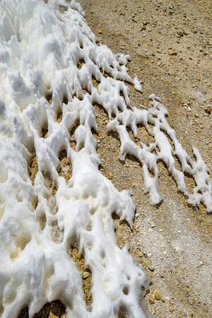 Snow and ice formations, known as Los Penitentes, form a lattice pattern on the ground near the abandoned sulfur mine of Mina Julia, in the high Andean puna desert of Salta province in Argentinaの写真素材