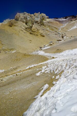 Snow and ice formations, known as Los Penitentes, block the high altitude road to the abandoned sulfur mine of Mina Julia, in the high Andean puna desert of Salta province in Argentinaの写真素材