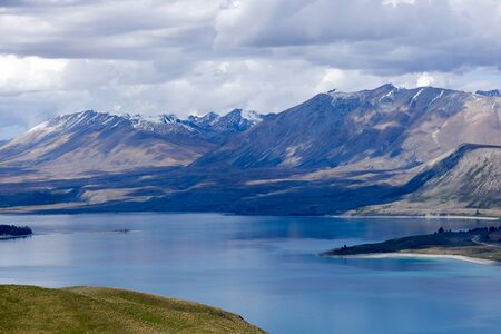 View from Mt John observatory overlooking Lake Tekapo in the mountains of New Zealand's South Islandの写真素材