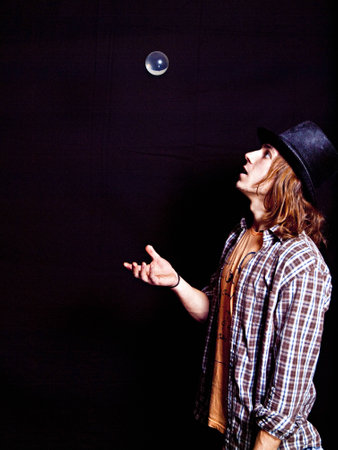 Boy with top hat and crystal ballの写真素材