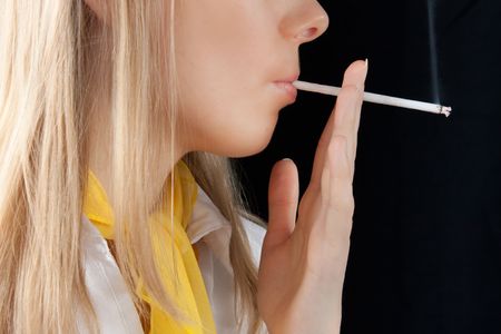 beautiful young girl smoking cigaretteの写真素材