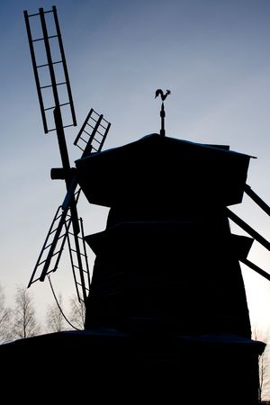 photo of the windmill silhouette with blue sky in backgroundの写真素材
