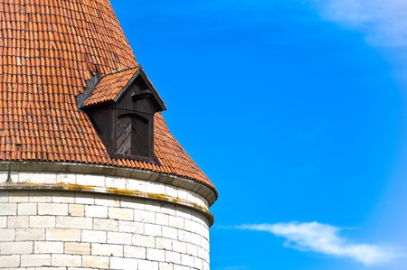 beautiful old roof top of Kuressaare castle tower with blue sky in background(Saarema, Estonia)の写真素材