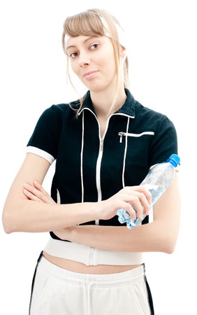 beautiful sexy young woman in sport wear isolated on white background with plastic bottle of waterの写真素材