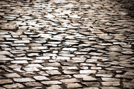 old beautiful cobblestone road in city in europeの写真素材