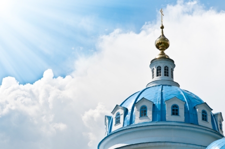 Blue dome of beautiful old russian church with cloudy sky in backgroundの写真素材