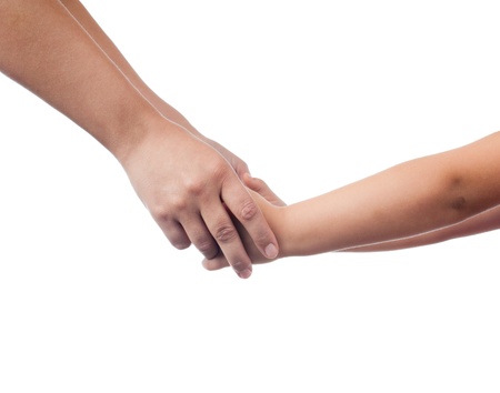 hands of mother and her child holding each other. Studio shot, isolated on white background.の写真素材