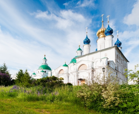 Spaso-Jakovlevskij monastery with blue cloudy sky in background and green grass in foreground. Rostov, Golden ring, Russia.の写真素材