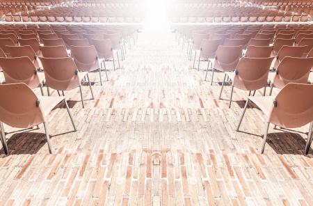 Abstract of rows of plastic chairs without people on them  Preparation for presentation or performance の写真素材