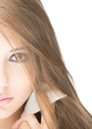 Portrait of stylish beautiful girl with long hair and bright make-up isolated on white background  Young business woman in black jacket and white blouse with raised collar looking serious and sexy の写真素材