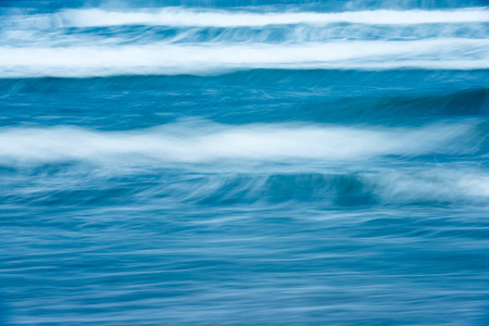 Scenic view of bright blue rough ocean with big foamy waves. Picturesque sea. Beautiful stormy waterscape and natural power. Amazing backgrounds and wallpapers.の写真素材