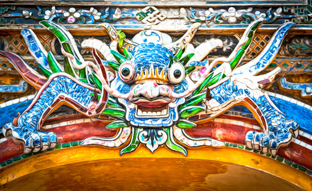 Dragon over gate to Hue citadel. Vietnam, Asia.の写真素材