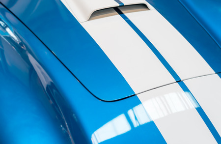 Blue and White Striped Hood with Hood Vent of Classic Carの写真素材
