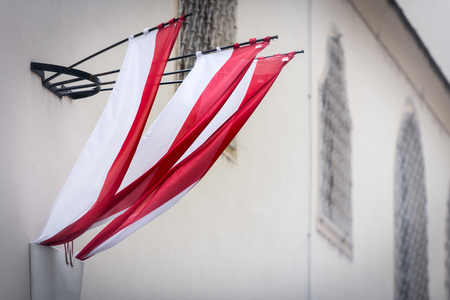 Austrian flag on wall of building in old town Vienna. Europe travel.の写真素材