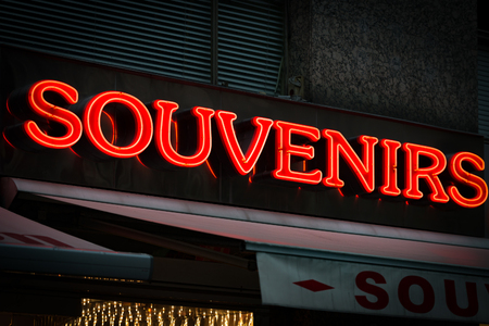 Red neon sign on souvenirs shop in Vienna, Austria. Europe travel.の写真素材