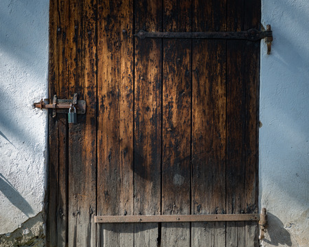Old door in Skansen open-air museum and zoo in Sweden, Stockholm. Old swedish traditional village. Scandinavia, Europe.のeditorial素材