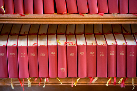 Stack of red bible books in church. Sweden, Scandinavia, Europeの写真素材